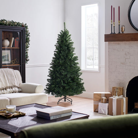 National Tree Company decorated tree in living room showcasing wide profile and festive display