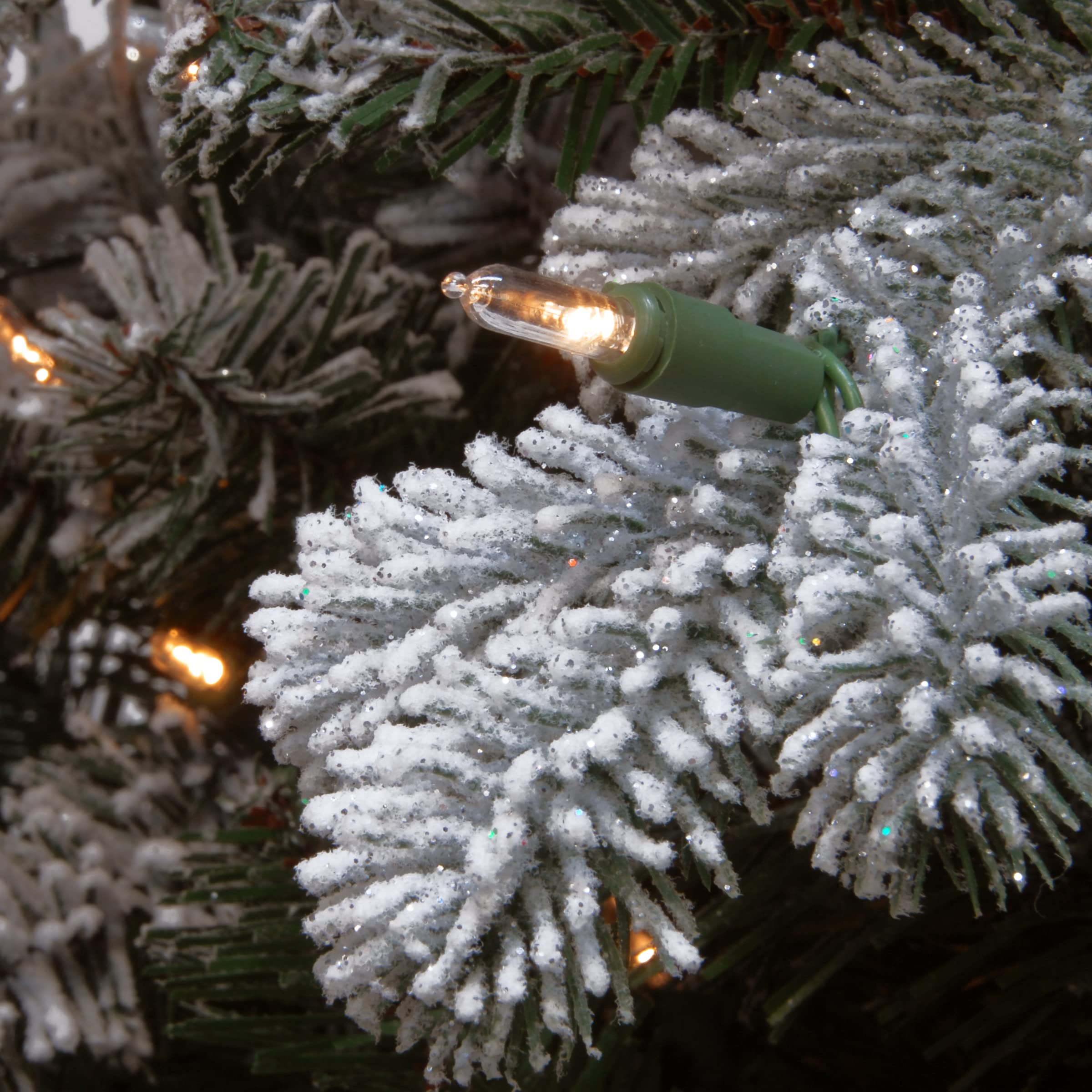 National Tree Company garland draped over mantel demonstrating easy styling and festive warmth