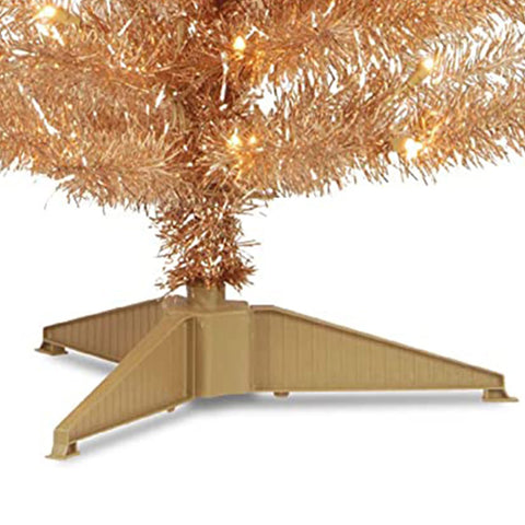 National Tree Company tree next to sofa showing scale and space-saving advantage