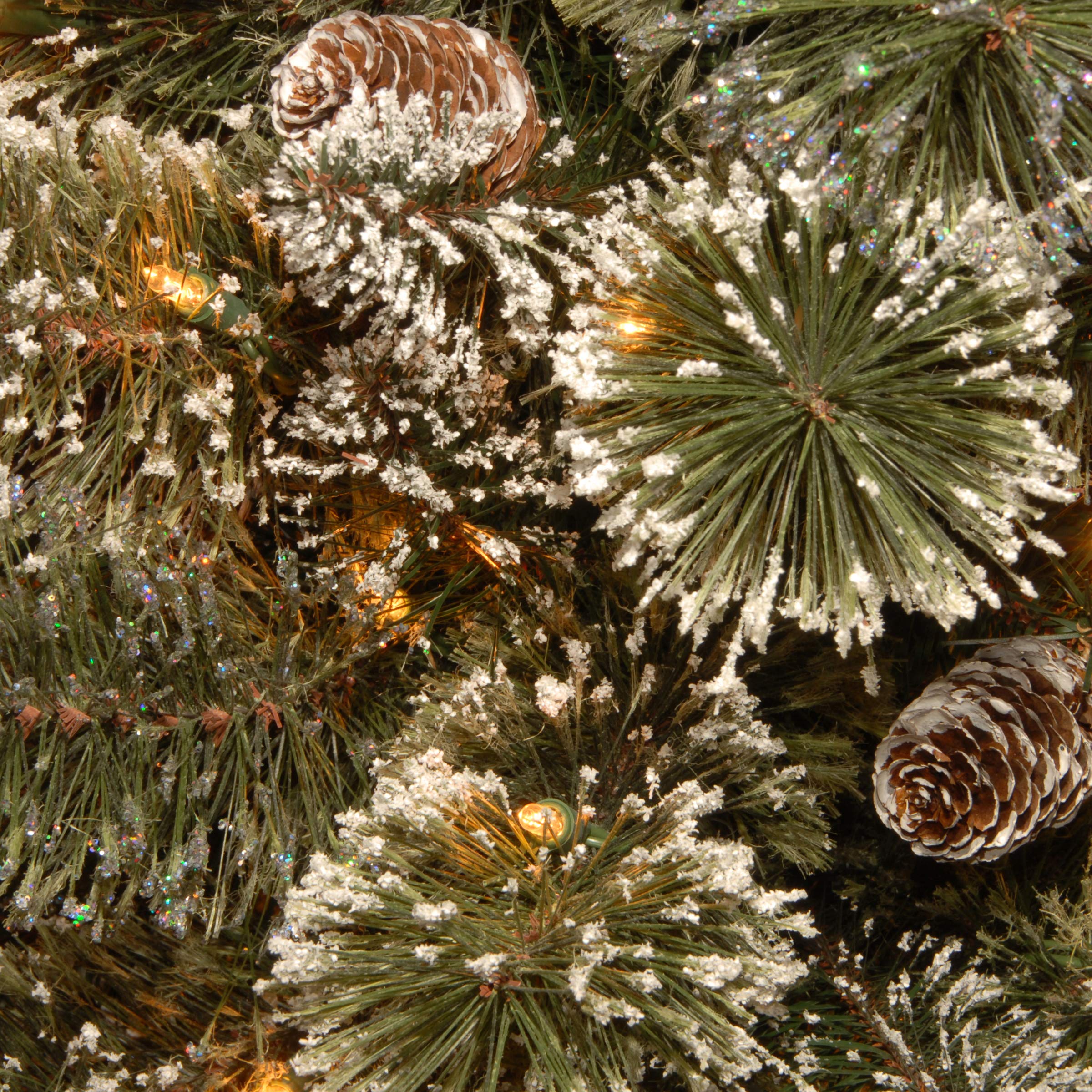 National Tree Company close-up of frosted branch and polyethylene tips, detailed texture adds realistic snowy appeal