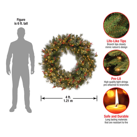 National Tree Company wreath illuminated at night showing warm lights and festive ambiance