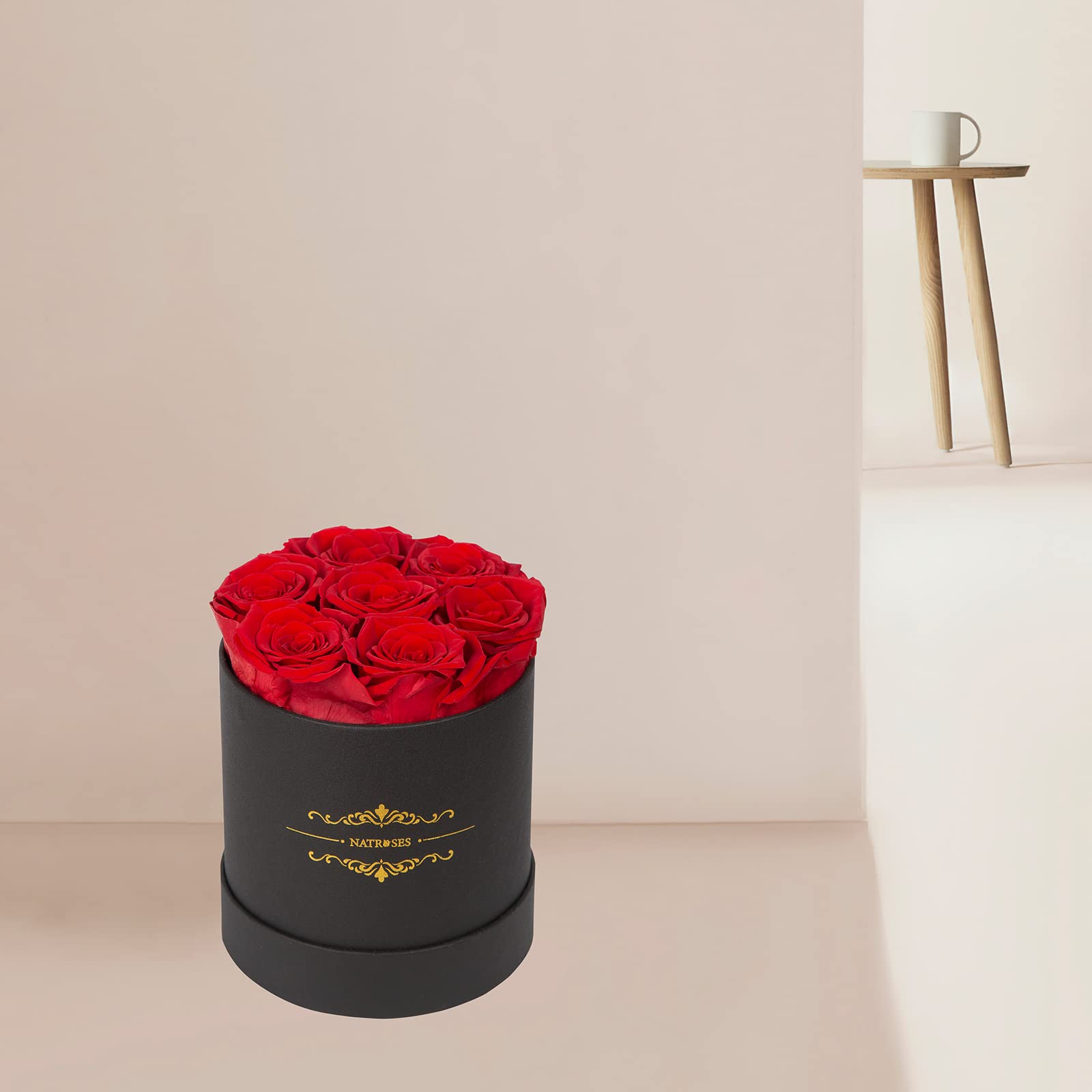 NATROSES rosebuds next to a hand for scale showing 2–2.5 inch size