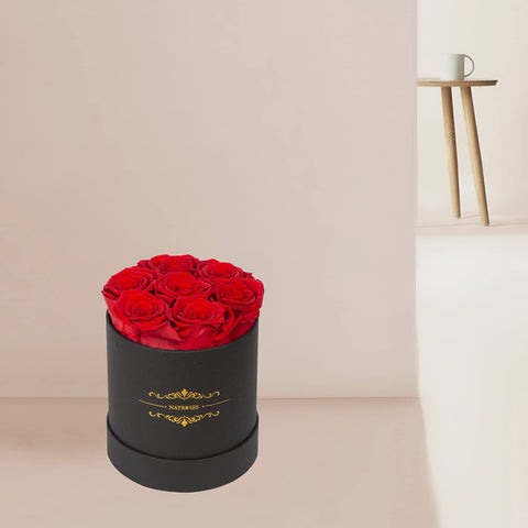 NATROSES rosebuds next to a hand for scale showing 2–2.5 inch size