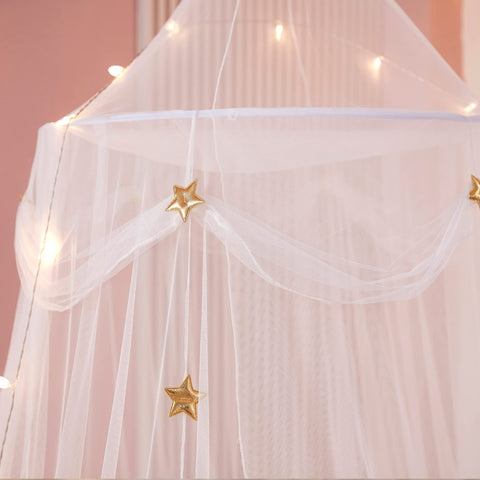 Nattey dome canopy in use over a twin bed, provides private play and rest area