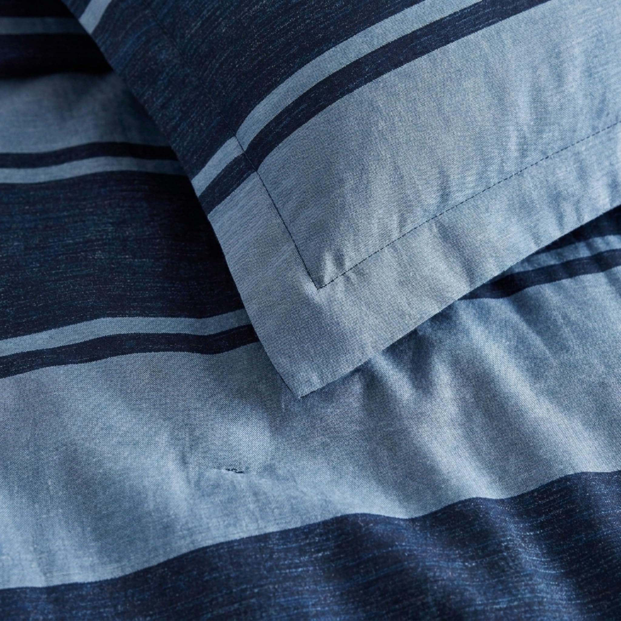 Nautica comforter styled in dorm room demonstrating compact, versatile dorm essentials