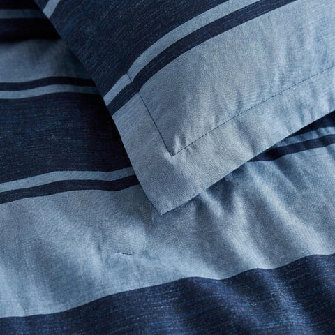 Nautica comforter styled in dorm room demonstrating compact, versatile dorm essentials