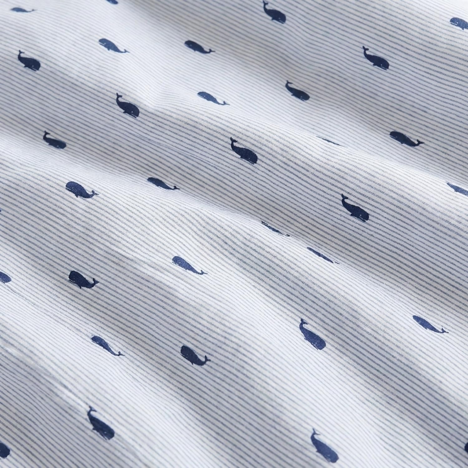 Nautica pillowcases styled on bed showcasing polished layered look and cohesive design