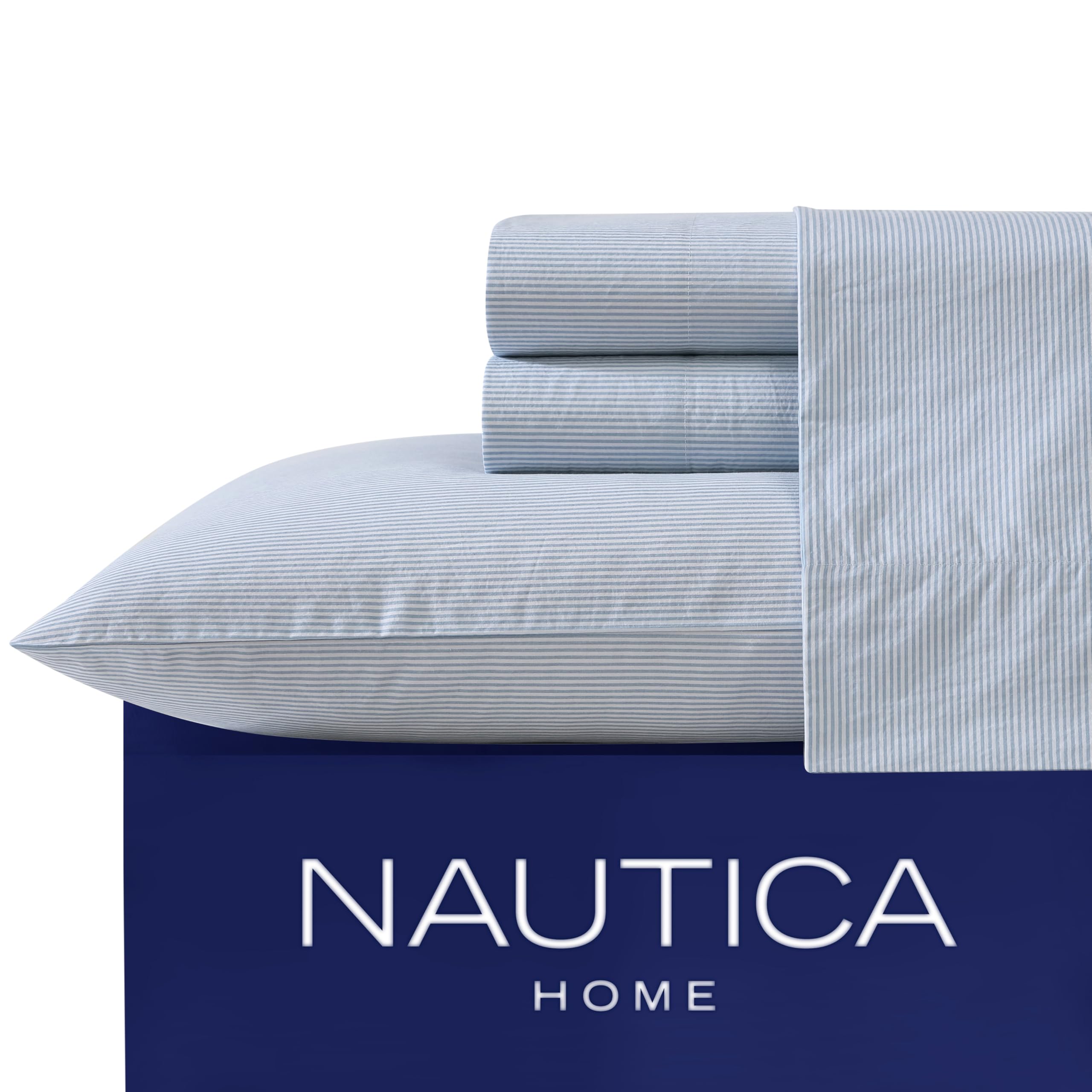 Nautica sheets in use on styled bedroom showing polished layered look