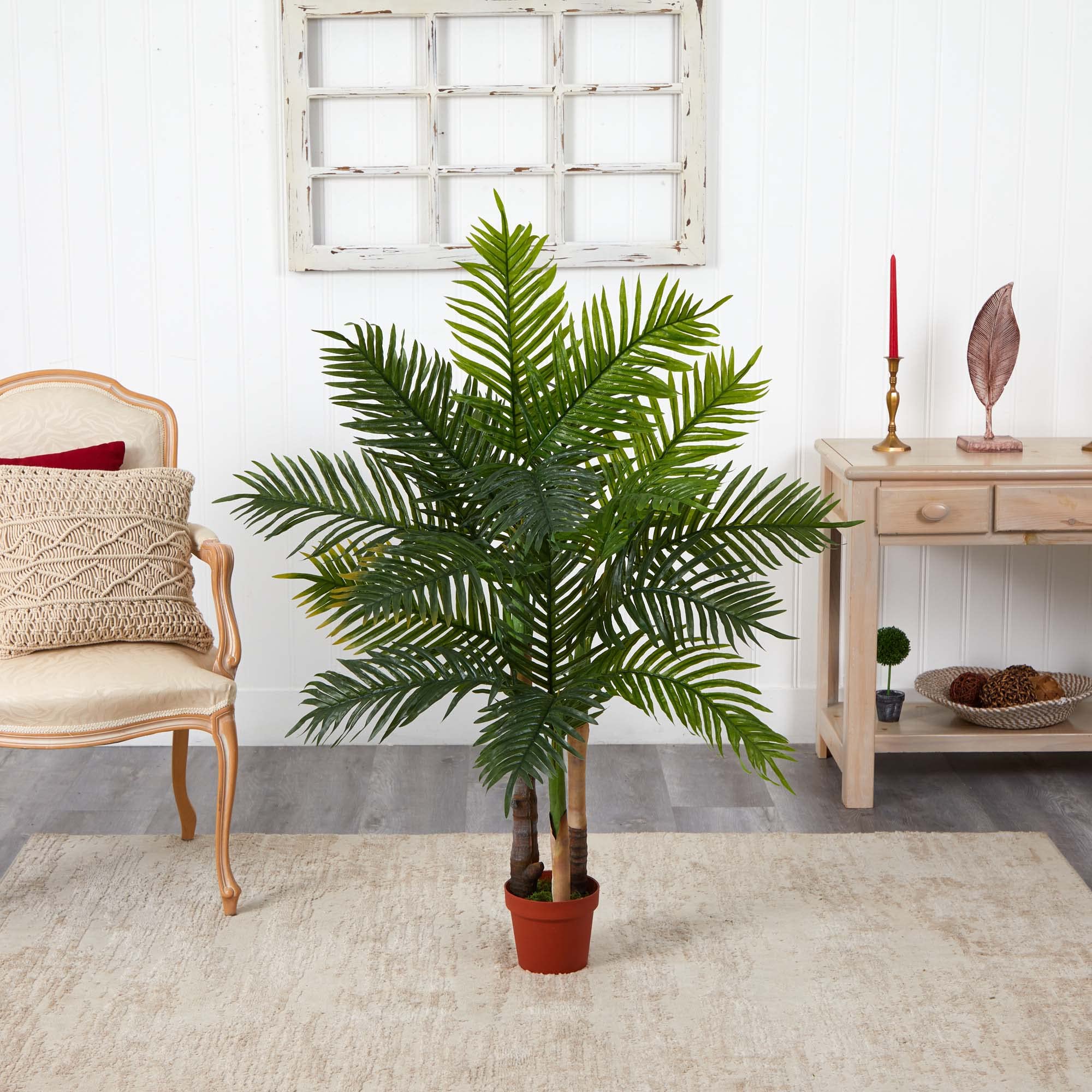Nearly Natural planter and scale beside furniture illustrating size and easy placement