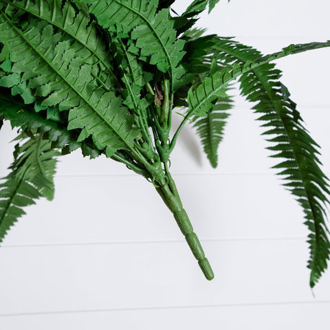 Nearly Natural fern styled in a hanging basket adding layered decor and height