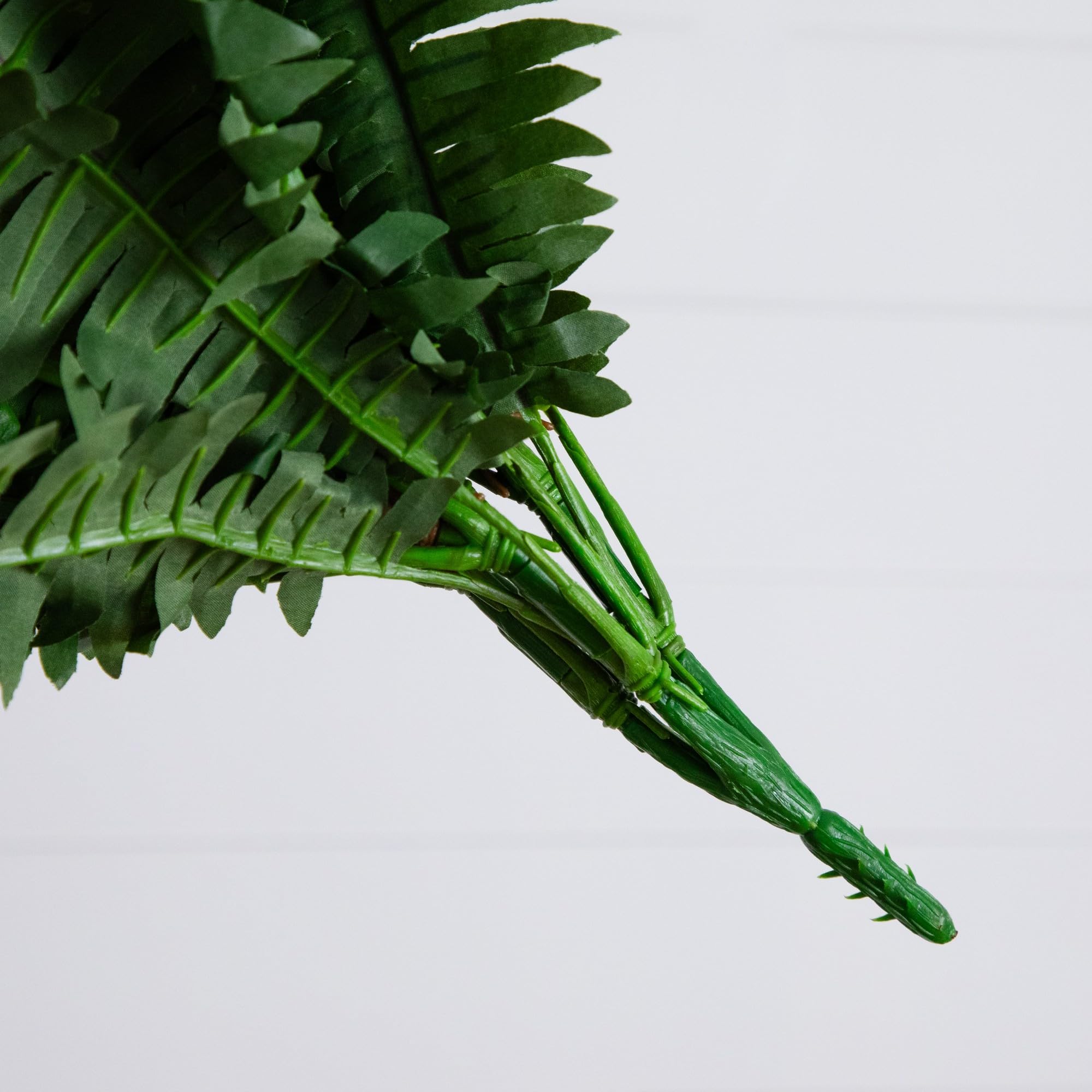 Nearly Natural fern styled in woven basket adding soft greenery and easy decor upgrade
