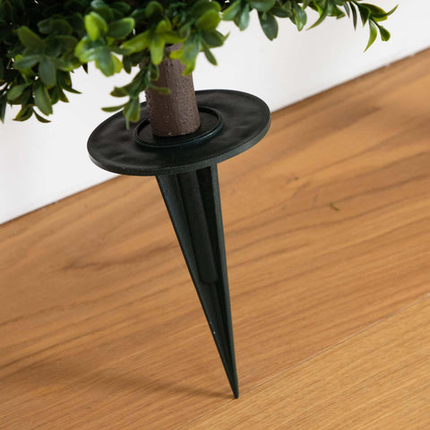 Nearly Natural hands shaping branches to customize fullness and silhouette