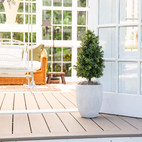 Nearly Natural matching pair styled in entryway adding structured greenery
