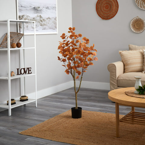 Nearly Natural hand reshaping branches to full shape showing adjustable design benefit