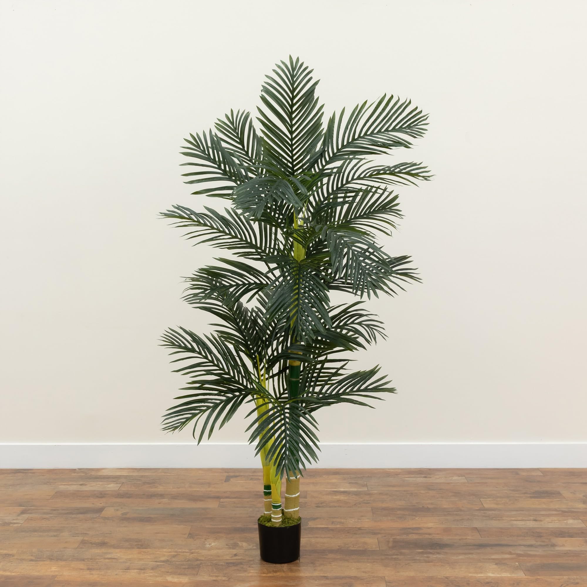 Nearly Natural palm in living room scene adding height and relaxed atmosphere