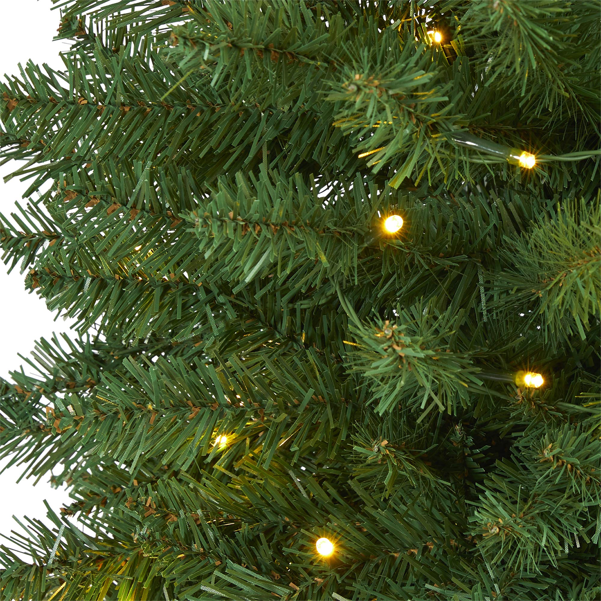 Nearly Natural tree lit at dusk displaying 50 clear LED lights and ambient glow benefit
