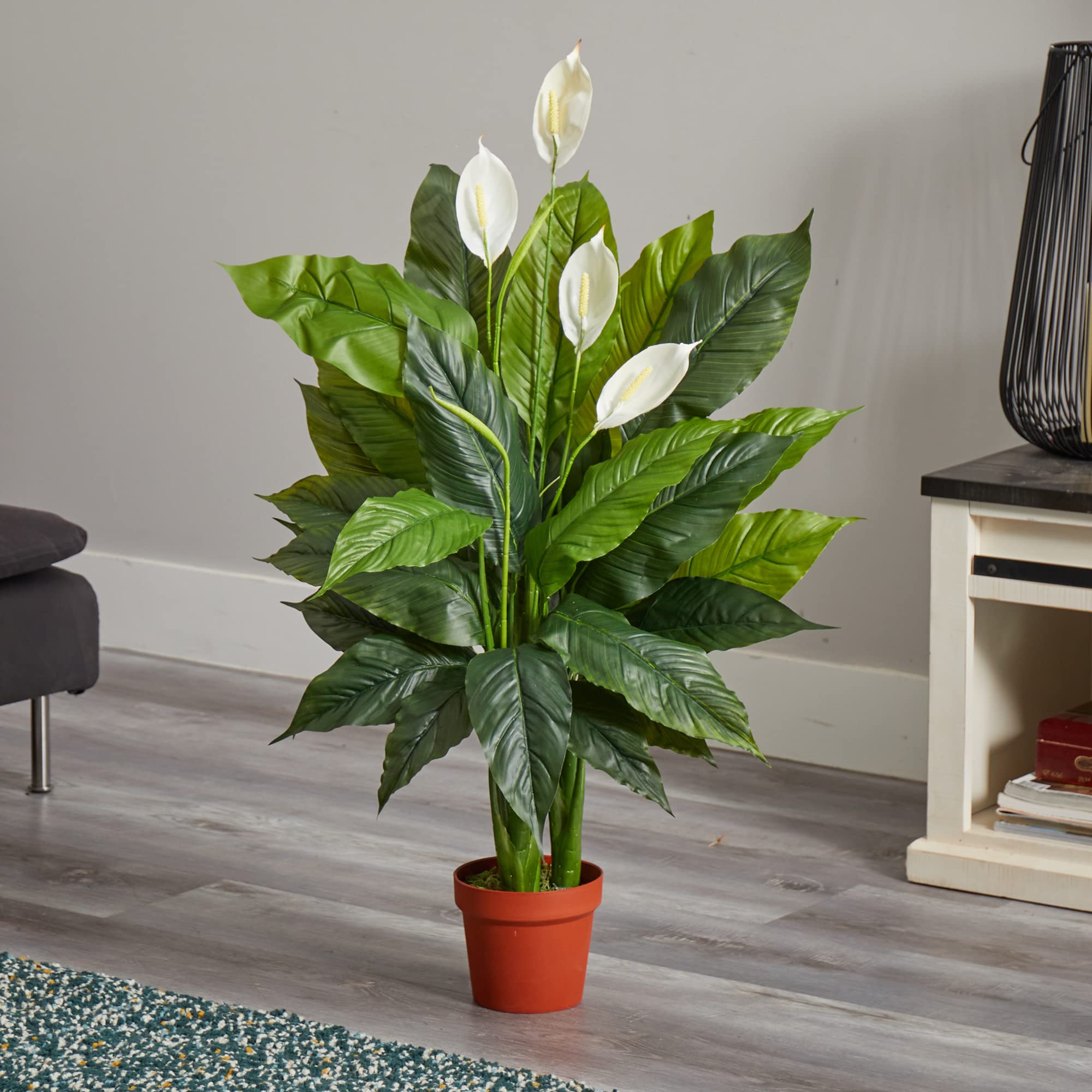 Nearly Natural peace lily leaf texture detail showing glossy green foliage and natural color variation benefit