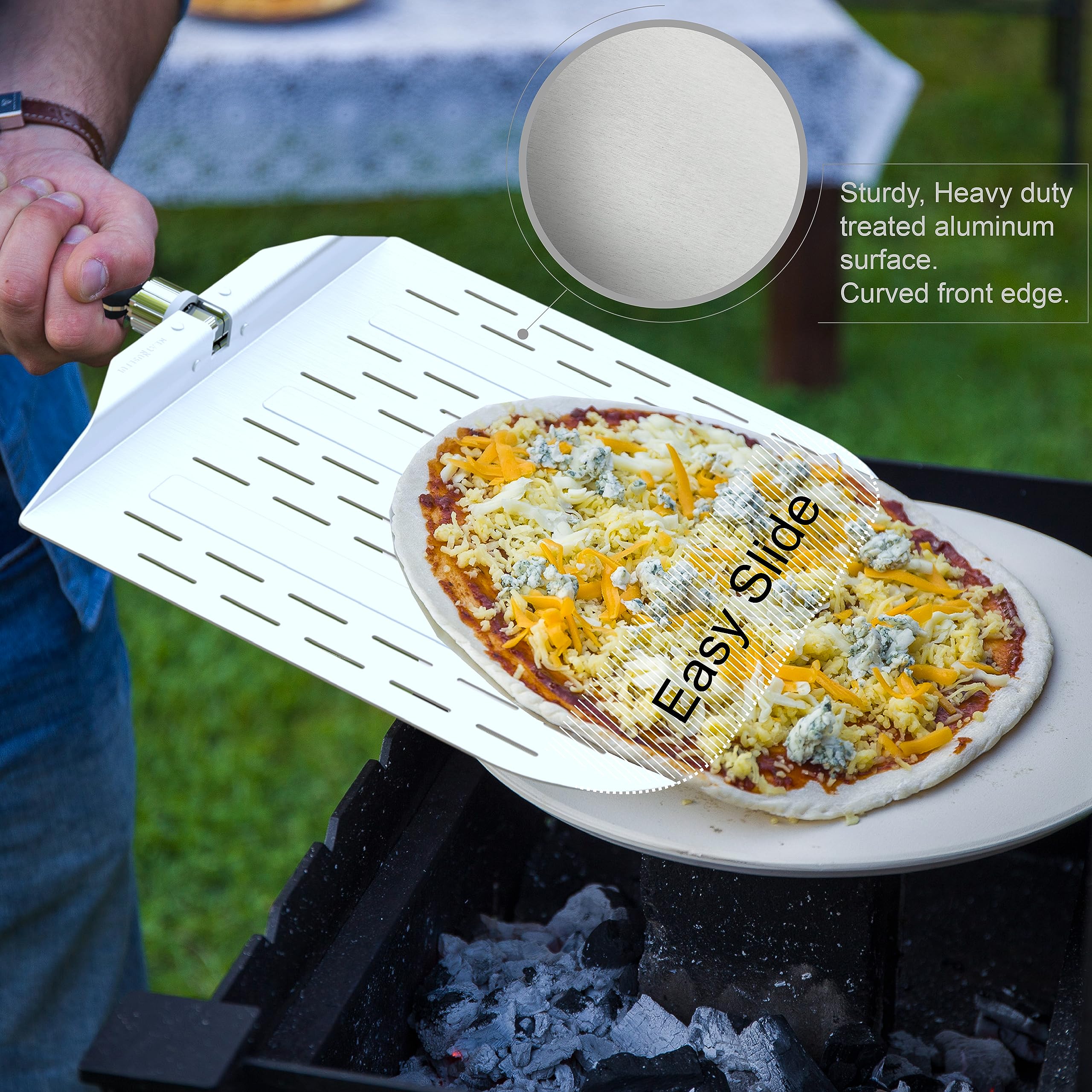 neatNuseful peel in use with Ooni oven, provides safe oven reach