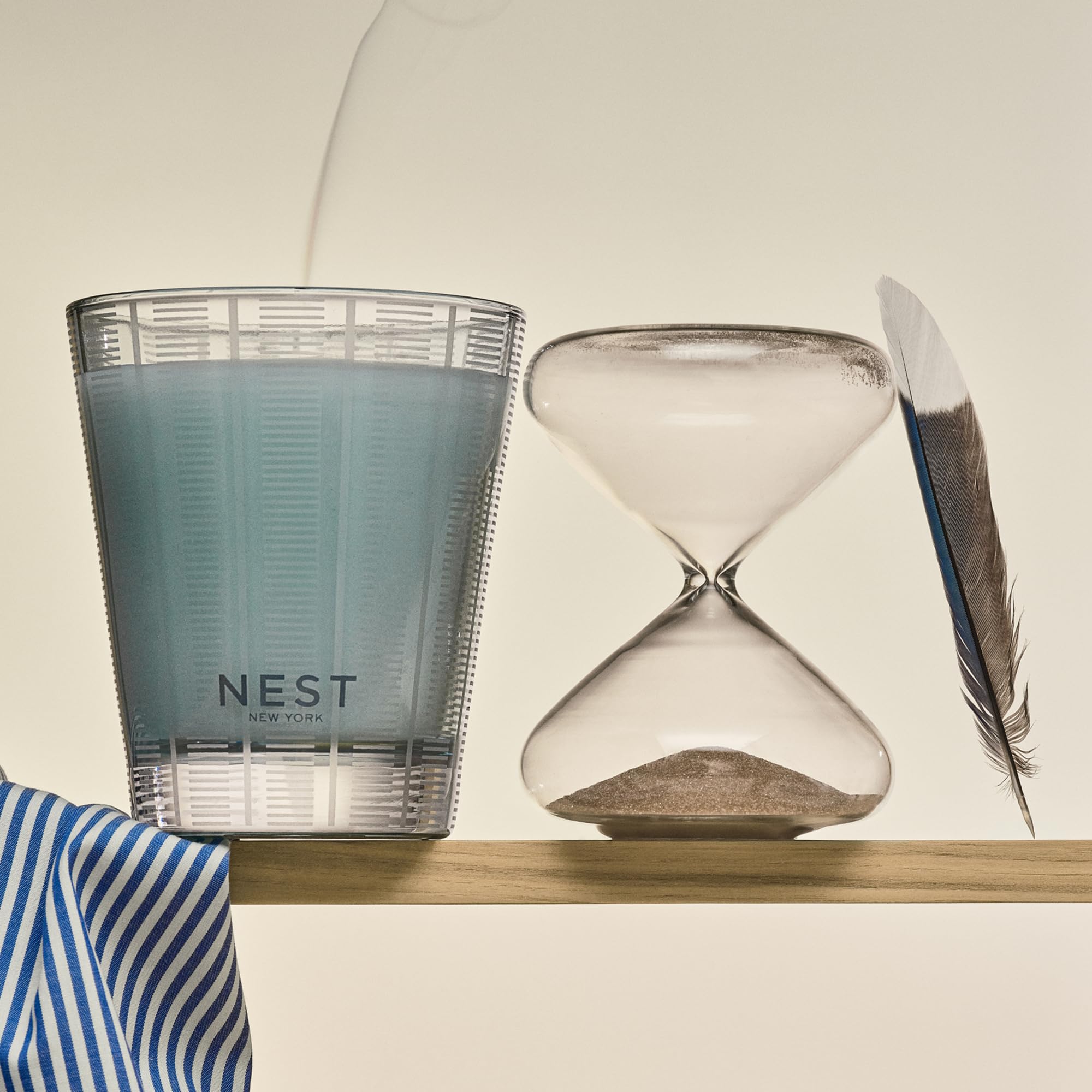 NEST New York candle on bathroom shelf styling a calming spa-like benefit