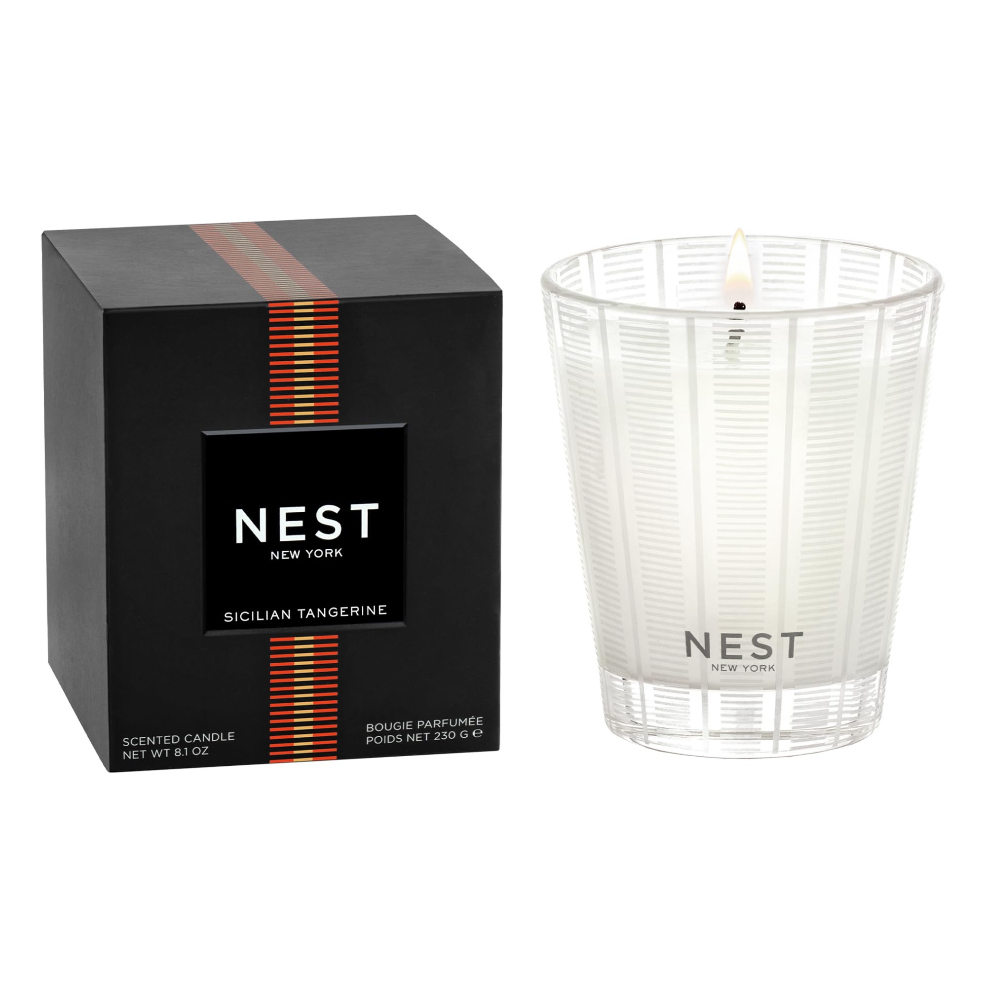 NEST New York candle front view shows striped frosted glass and vibrant citrus appeal