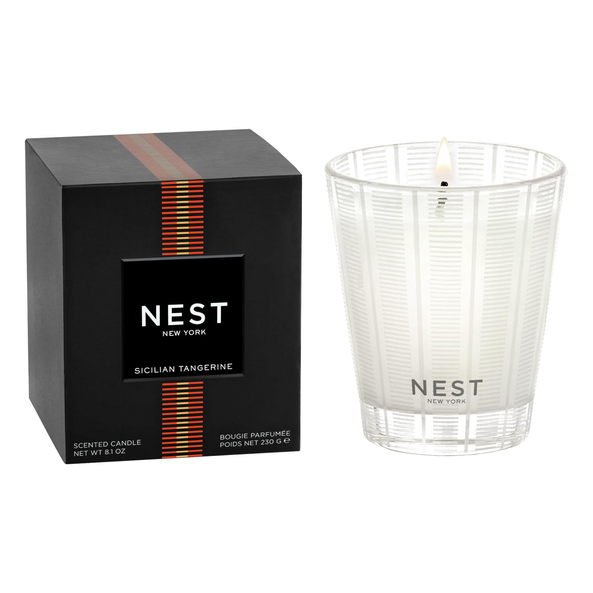 NEST New York candle front view shows striped frosted glass and vibrant citrus appeal