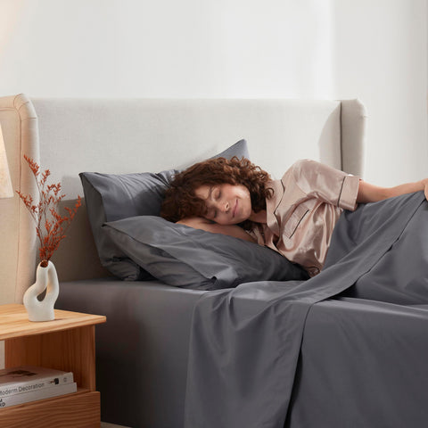 Nestl styled bedroom with dark grey sheets showing a polished, low-maintenance look