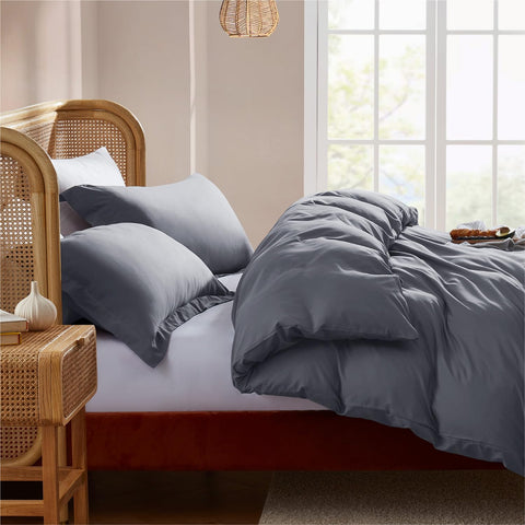 Nestl folded duvet cover set next to ruler showing compact size for storage
