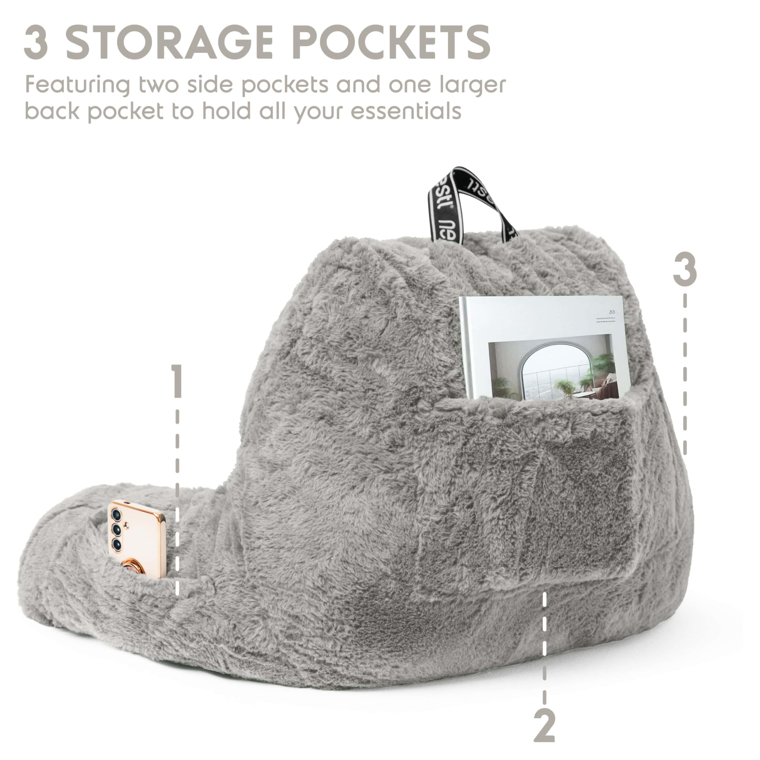 Nestl close view of three pockets holding remote and tablet for organized lounging