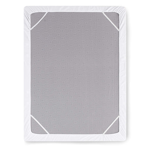 Nestl flat sheet fully spread over mattress showing generous coverage and tuckability