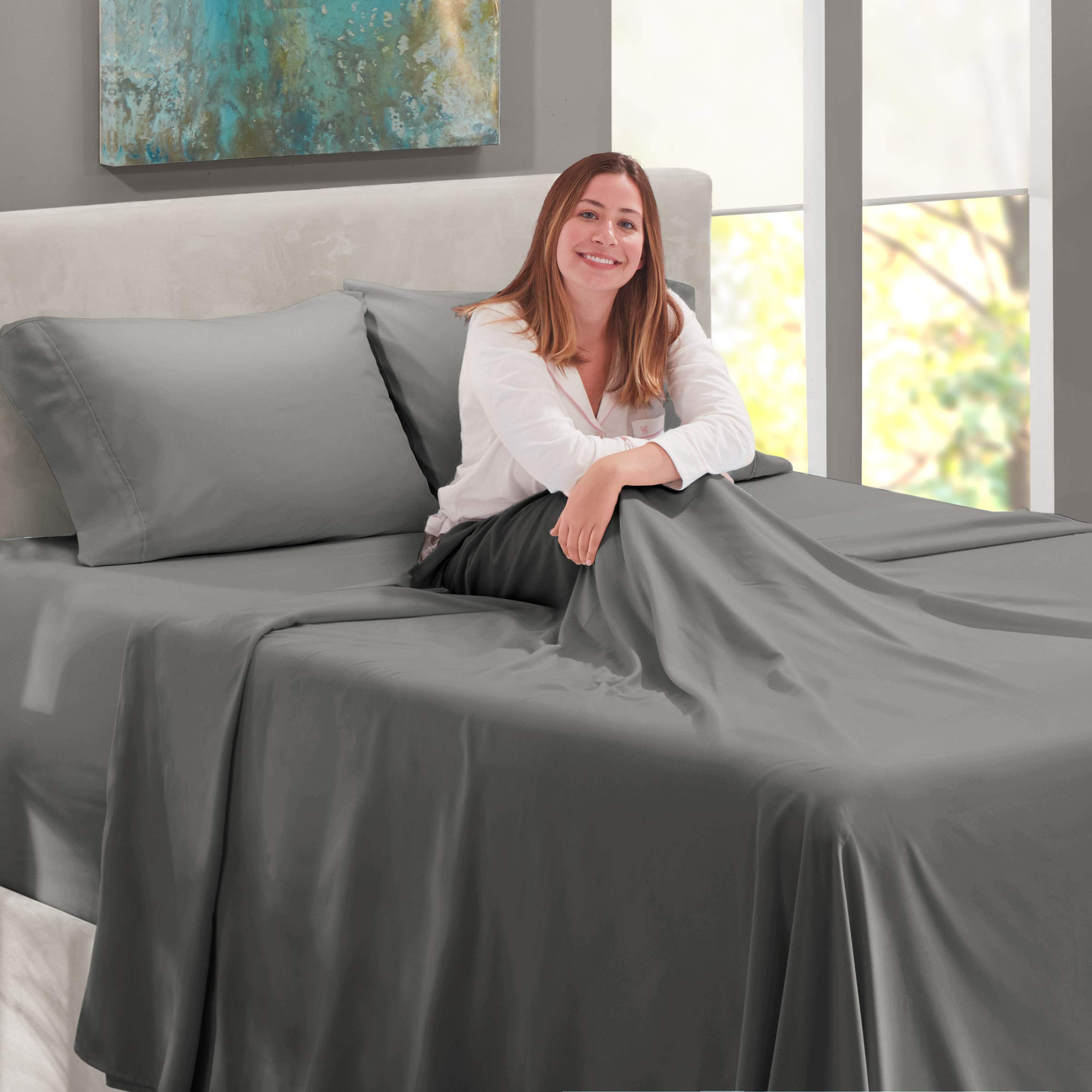 Nestl fitted sheet on deep mattress with topper illustrating true 21-inch pocket fit
