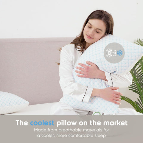 Nestl pillows styled on bed illustrating cooler, comfortable sleep setup