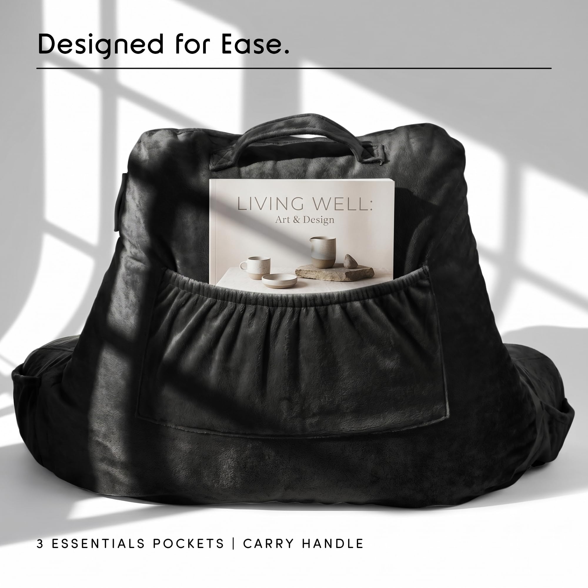Nestl pillow beside a book showing scale and ideal sizing for beds