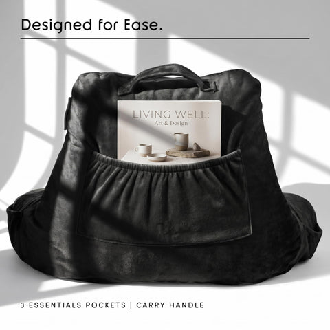 Nestl pillow beside a book showing scale and ideal sizing for beds