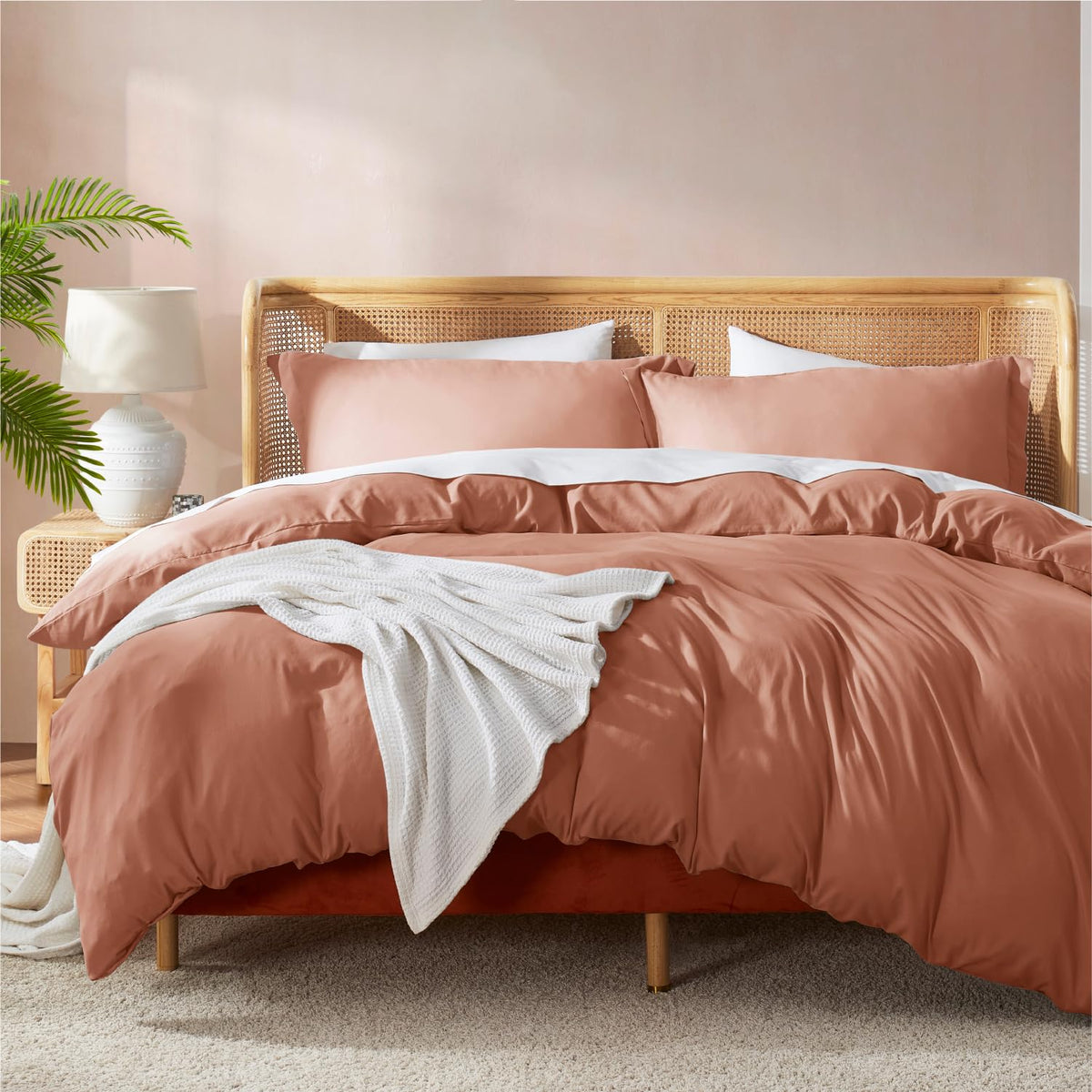 Nestl rust front view showing full king duvet cover on bed, inviting comfort