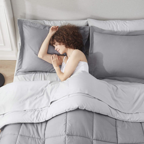 Nestl comforter laid on queen mattress showing fit and full coverage benefit