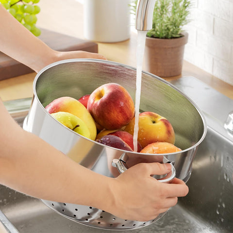 New England Stories steamer held by hand showing 11 qt scale and home-friendly size