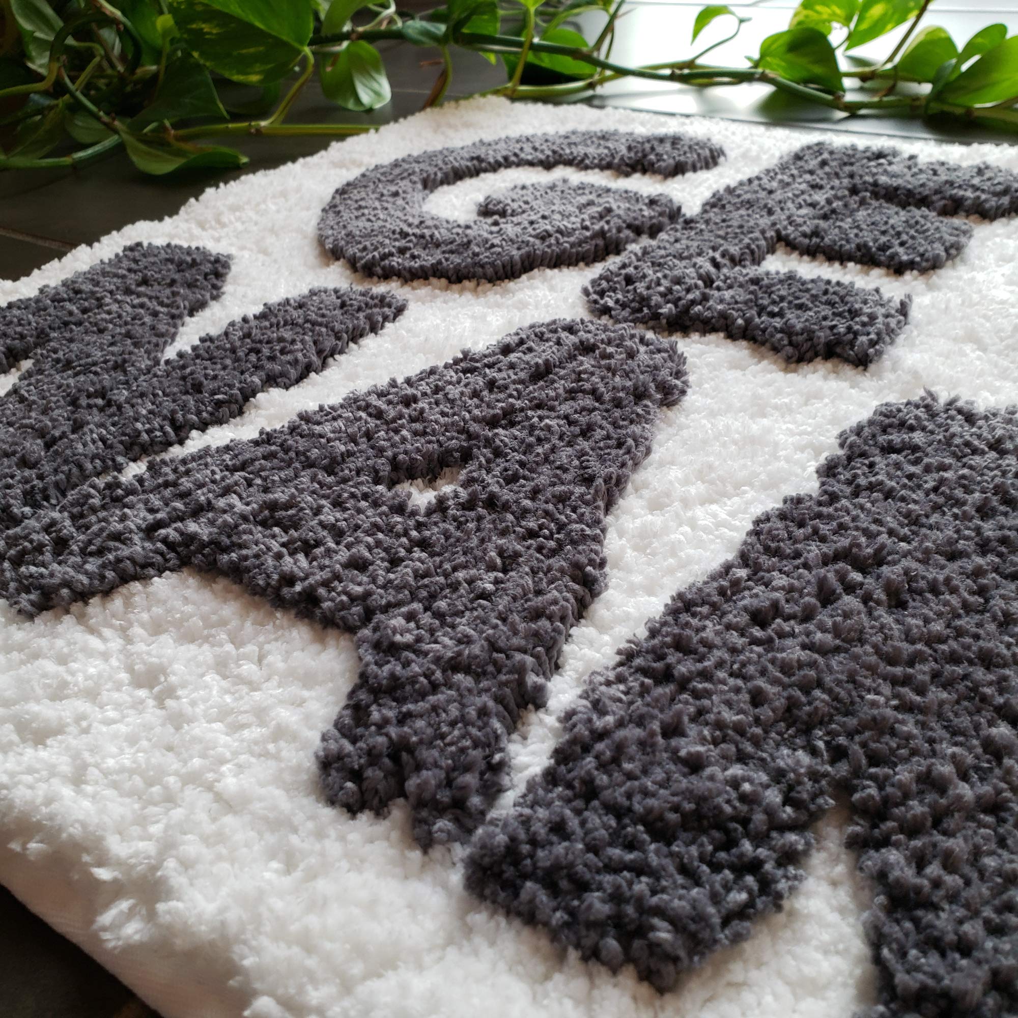 New Mungo mat next to bathtub showing 31x20 inch scale for small spaces