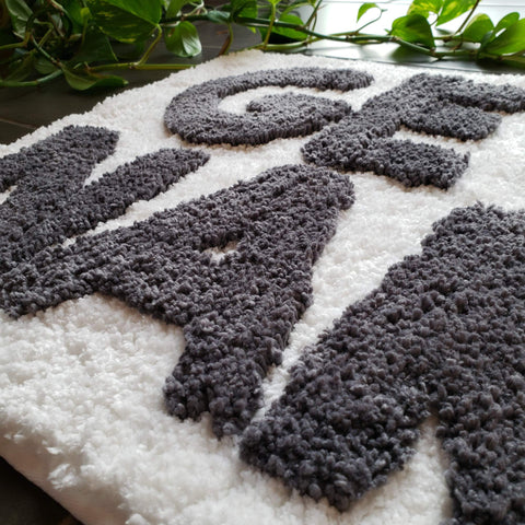New Mungo mat next to bathtub showing 31x20 inch scale for small spaces