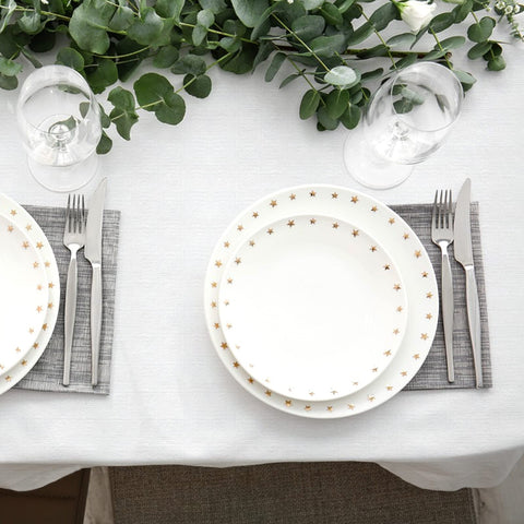 NEWOOK tablecloth next to chair showing scale and generous coverage