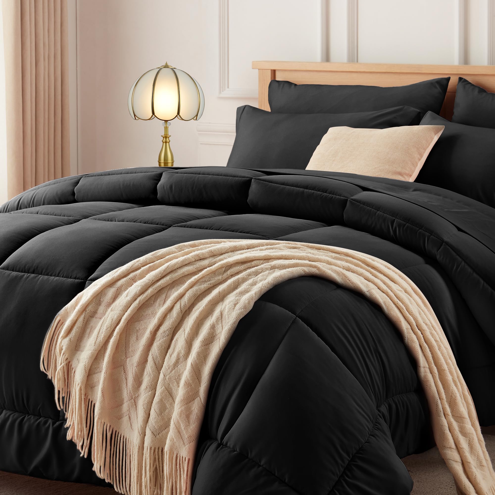 Newspin full comforter front view showing sleek black bedding and cozy appeal