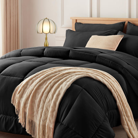 Newspin full comforter front view showing sleek black bedding and cozy appeal