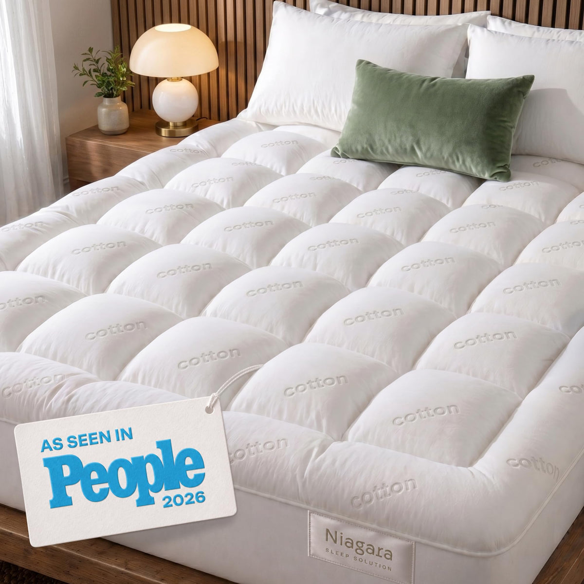Niagara Sleep Solution front view showing topper on California King bed, improves comfort