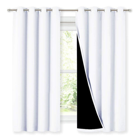 NICETOWN front view of white blackout curtains shows full coverage and elegant drape
