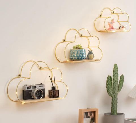 Niemro front view of three gold cloud shelves showing floating style and warm glow