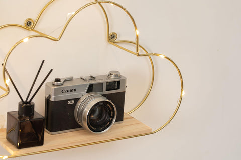 Niemro detail of gold metal wire frame highlighting cloud silhouette and elegant look