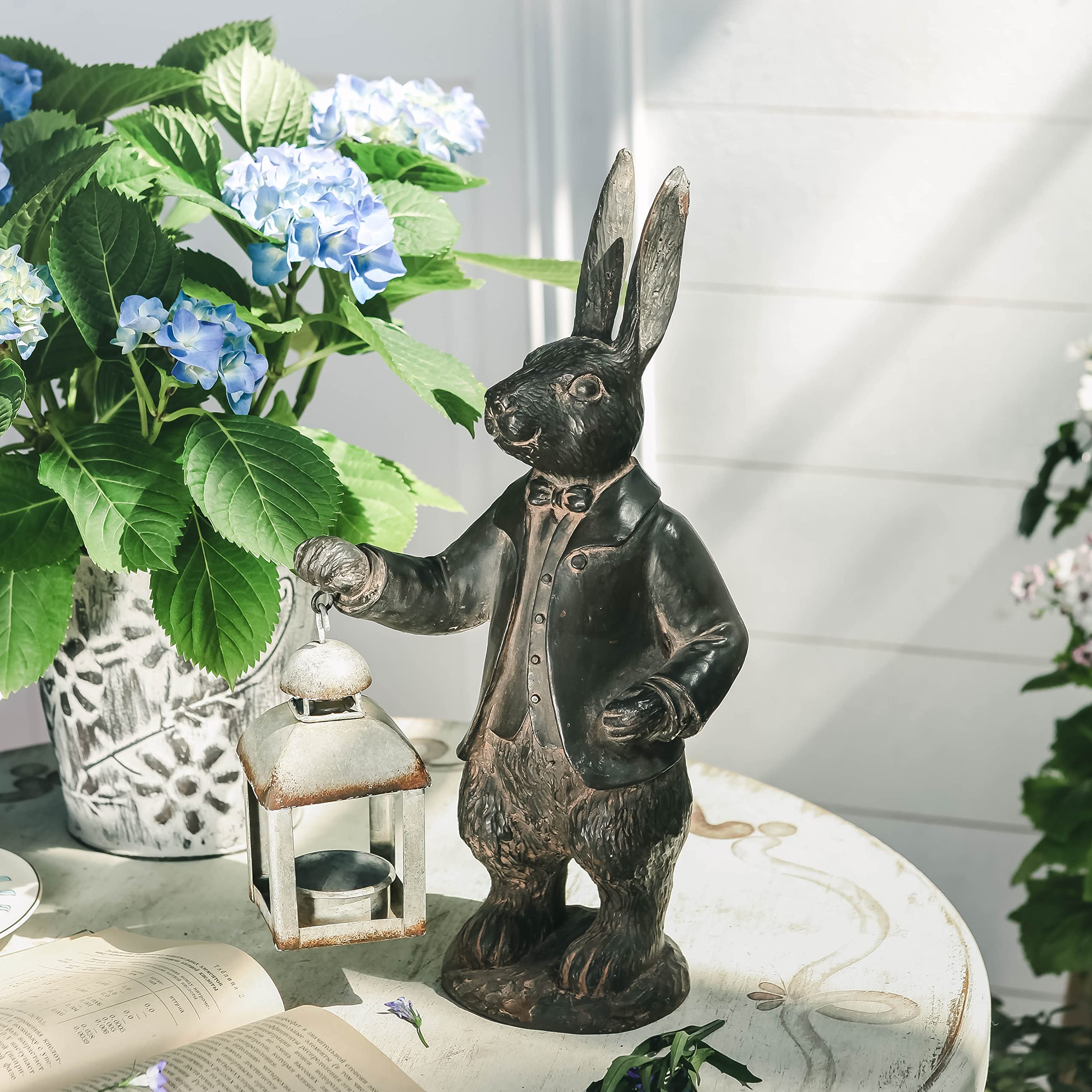 NIKKY HOME lantern hanging from rabbit hand demonstrating display options