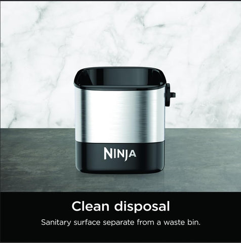 Ninja knock box in use with portafilter demonstrating fast puck removal benefit
