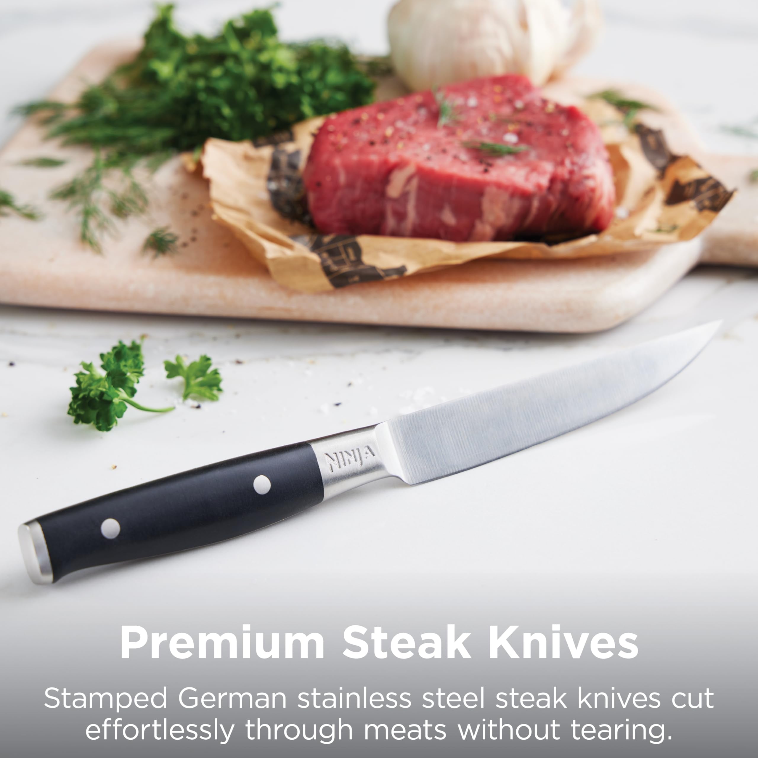 Ninja NeverDull knives held in hand to show real-world size and safe handling