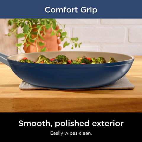 Ninja sauté pan with lid cooking vegetables to show even browning benefit