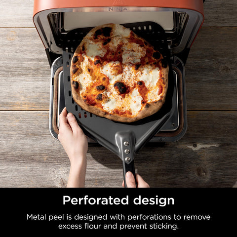 Ninja peel lifting a pizza from oven for precise maneuvering